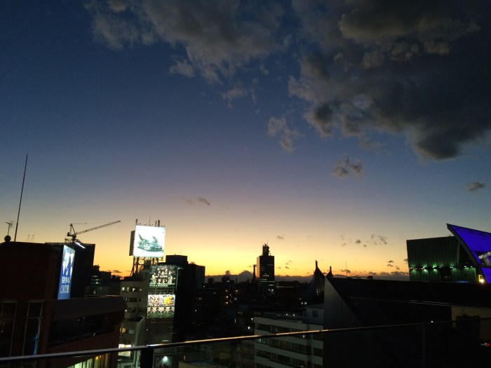 Tonight, stood on the roof of a department store in Harajuku and watched the sun set. Fuji is visible in the distance.